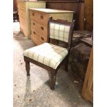 A 19thc. mahogany child's chair with scroll top rail above a later upholstered back and seat, on