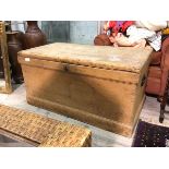 A late 19thc/early 20thc pine chest, the hinged lid above a storage space, with candlebox to one