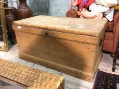 A late 19thc/early 20thc pine chest, the hinged lid above a storage space, with candlebox to one