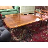 A reproduction mahogany Regency inspired coffee table, the rectangular top with rounded edges on