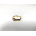 A 9ct gold gypsy set ring with diamond (U) (4.43g)