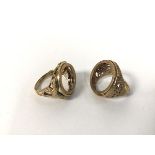 Two 9ct gold sovereign rings, one with a serpent design with red stone eyes, the other with