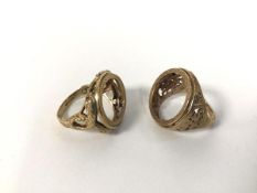 Two 9ct gold sovereign rings, one with a serpent design with red stone eyes, the other with