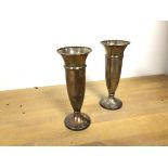 A pair of 1961 Birmingham silver flower tubes with flared rims and faceted tapering bodies, with