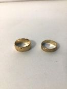 Two 9ct gold wedding bands, one with a geometric design, the other foliate (combined: 5.1g)