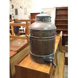 A copper water urn with brass handles to sides and tap to base, stamped Scottish Co-operative