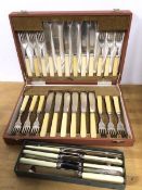 A boxed set of twelve dinner knives and forks with bone handles, in original case and a further