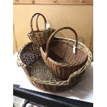 A collection of wicker ware including three baskets and a dog bed (22cm x 58cm)