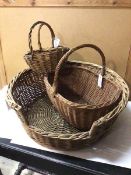 A collection of wicker ware including three baskets and a dog bed (22cm x 58cm)