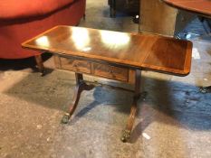 An Edwardian low occasional table, in the form of a sofa table, the rectangular top with two drop