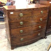 An early 19thc mahogany bow front chest, fitted two short drawers and three graduated long