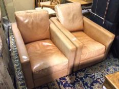 A pair of Valdichienti club armchairs of rectangular form, in tan leather (each: 70cm x 66cm x