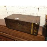 A 19thc rosewood writing slope, with brass detail, the interior with felt slope and compartments (