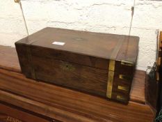 A 19thc rosewood writing slope, with brass detail, the interior with felt slope and compartments (