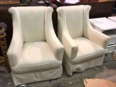 A pair of mid 20thc lounge chairs with rolled backs and downswept arms, in a light cream striped