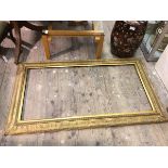 A gilt composition mirror of classical design (internal: 122cm x 61cm)