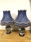 A pair of modern table lamps, of ginger jar form with leaf and fruit decoration and gilt highlights,