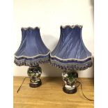 A pair of modern table lamps, of ginger jar form with leaf and fruit decoration and gilt highlights,