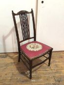 An Edwardian mahogany bedroom chair, with fan surmount to top rail above a pierced splat with