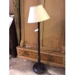 A 1920s floor lamp, with turned stem on circular base (133cm to top of shade)