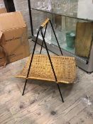A wicker basket with fixed handle on painted metal A frame support (h.48cm)