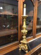 A modern composition gilt table lamp of rococo style (78cm to top of lampholder)