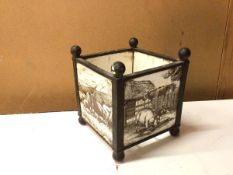 An early 20thc planter formed of metal frame with four tiles depicting animals and imprinted verso