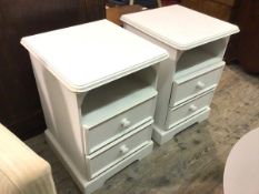 A pair of modern white painted bedside tables, the rectangular tops with moulded edges, with