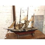 A model three masted tall ship on stand (a/f) (with stand: 84cm x 98cm x 34cm)