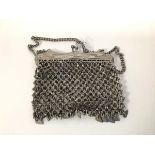 An early 20thc Art Nouveau style metal mesh evening bag with chain (bag: 12cm x 11cm)