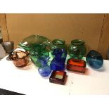 A collection of coloured glass including a green flower bowl of undulating form (13cm x 30cm x