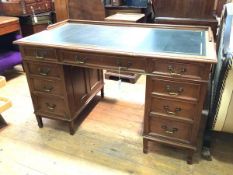 A c.1900 mahogany pedestal desk, with raised edge to back and sides, tooled leather writing surface,