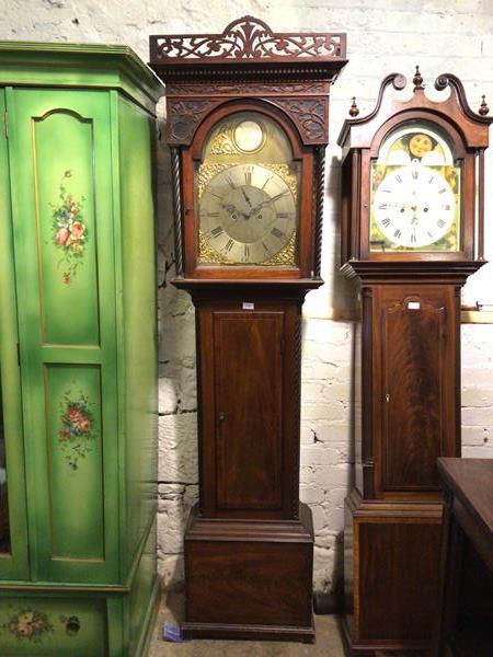 A George III mahogany longcase clock, by J. Stewart, Glasgow, the 14 inch arched brass dial with