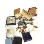A mixed lot of costume jewellery including paste pearls, earrings, brooches, paste beads, a small