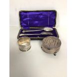 A Birmingham Edwardian silver napkin ring, a silver footed lidded box (h.3.5cm) and a boxed Epns