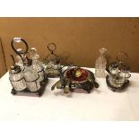 A group of cruet sets including one large cruet set with four bottles on Epns stand (23cm), two