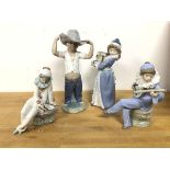 A group of four Nao figures, including two Seated Musicians, Boy dressed as Cowboy (25cm) and