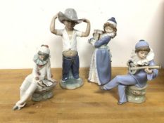 A group of four Nao figures, including two Seated Musicians, Boy dressed as Cowboy (25cm) and