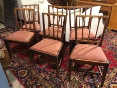 A near set of six early 19thc mahogany side chairs, the banister backs with wheatsheaf decoration,