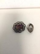 A silver brooch with oval bluejohn panel (4cm) and another silver brooch with floral design (2)