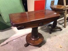 A William IV mahogany tea table, the rectangular hinged swivel top, on tulip style supports, with