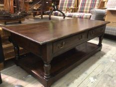 A Georgian inspired coffee table, the rectangular top with moulded edge above two frieze drawers, on