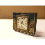A 1940s/50s Japanese style table clock, inscribed Made in France (9cm x 10cm x 5cm)
