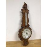 A 1920s banjo style wall barometer with carved edge (86cm)