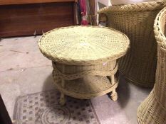 A painted wicker verandah table, the circular top above a lower tier, on four supports (54cm x