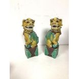 A pair of Chinese Dogs of Fou, in polychrome glaze, both marked China with seal mark to base (25cm)