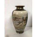 A Satsuma vase of baluster form with gilt decoration, depicting Village Scenes (40cm), makers seal