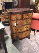 A first half of the 20thc Georgian inspired chest of drawers, with serpentine front above brush