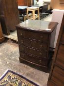 A small Georgian inspired reproduction bow front chest of drawers, the rectangular top with