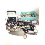 A collection of costume jewellery including necklaces, earrings, polished stone beads, a silver